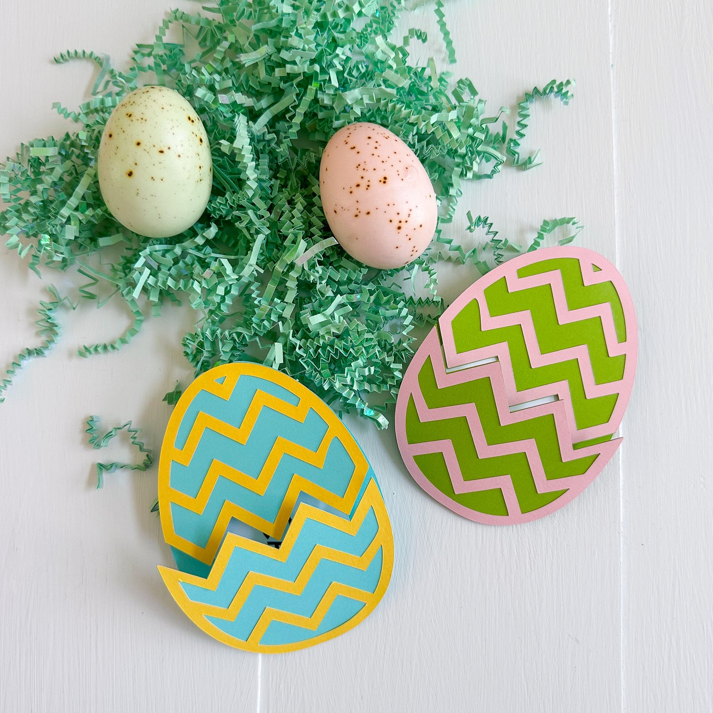 Easter egg gift card holders with zigzag pattern on a white background