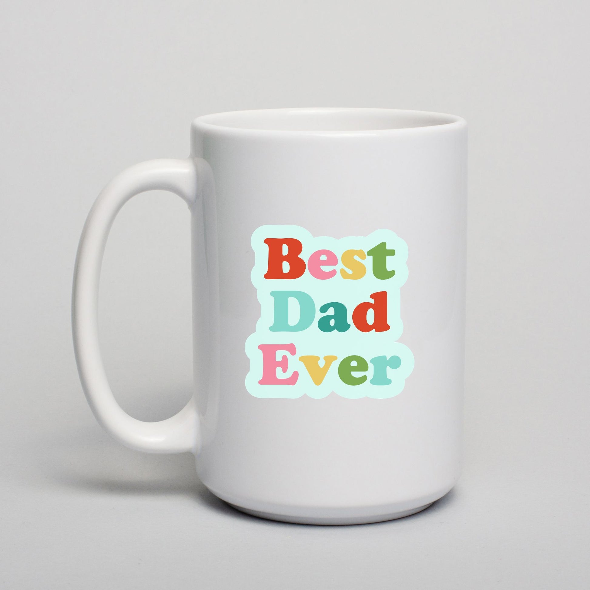 White mug with 'Best Dad Ever' text in colorful letters on a light gray background