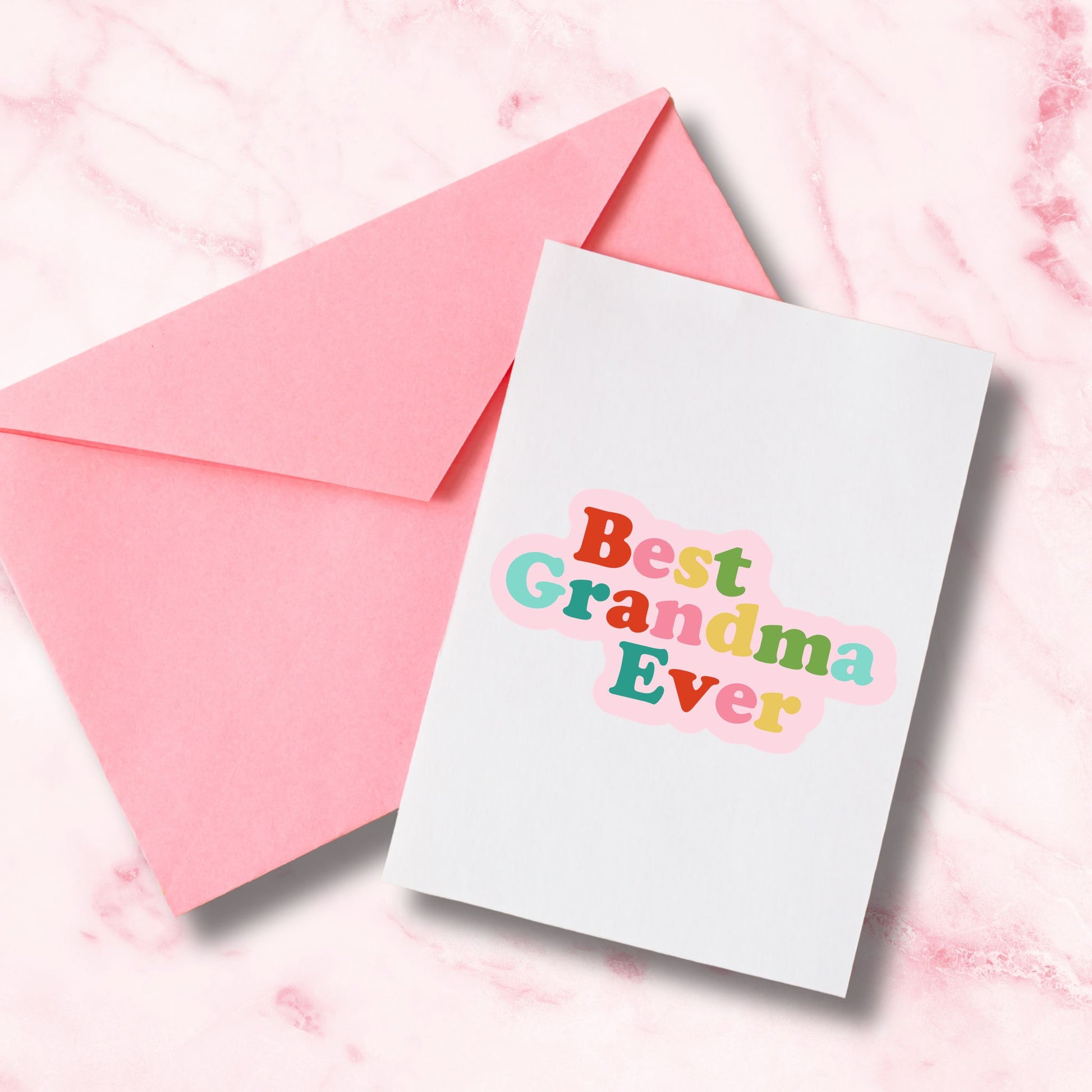 Greeting card with 'Best Grandma Ever' SVG design  and a pink envelope on a pink marble background