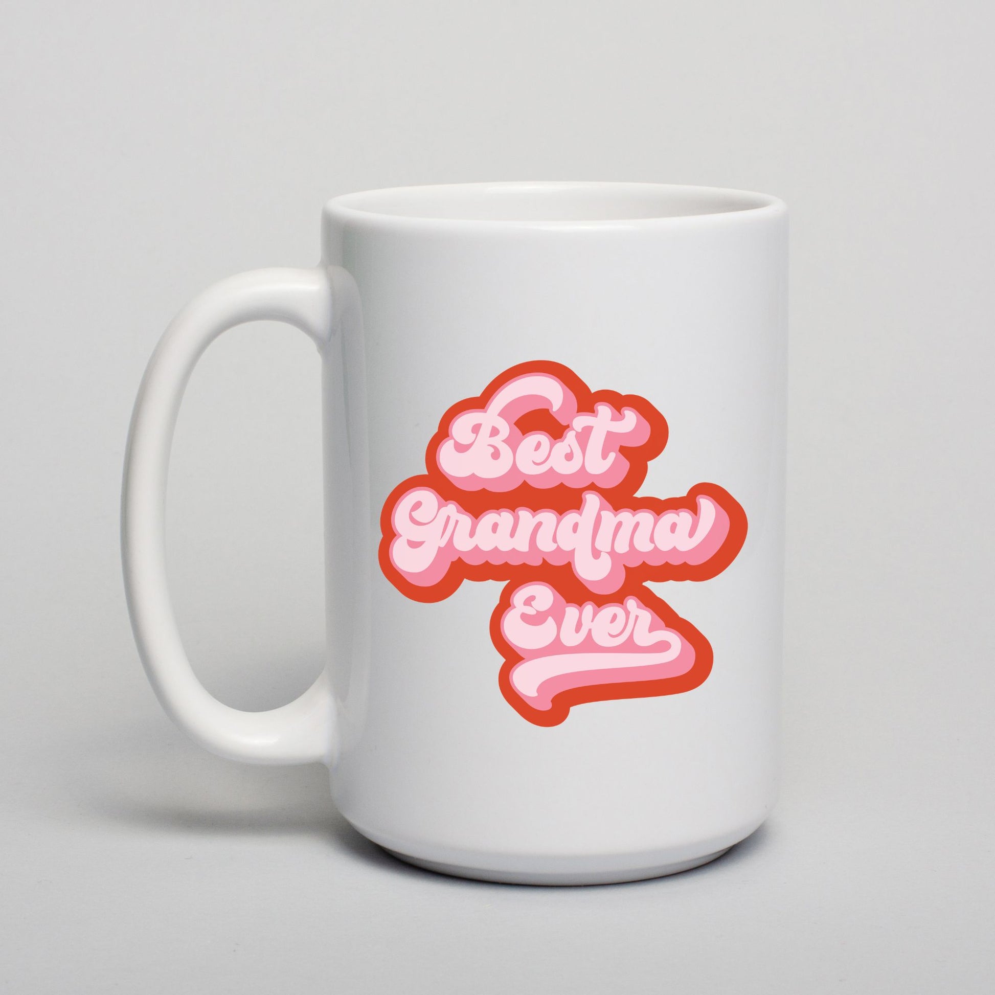 White mug with 'Best Grandma Ever' text in pink on a light gray background
