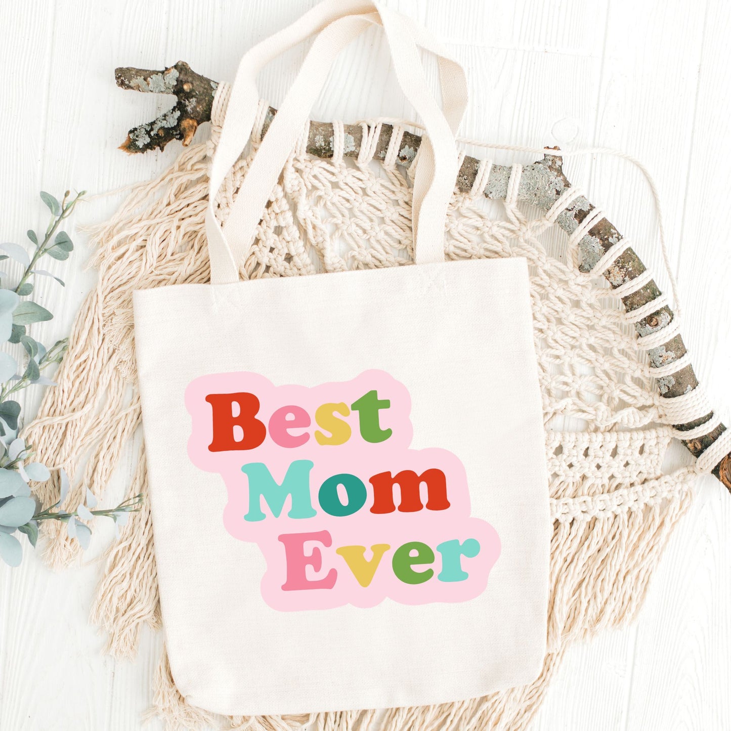 Tote bag with 'Best Mom Ever' text on a decorative background