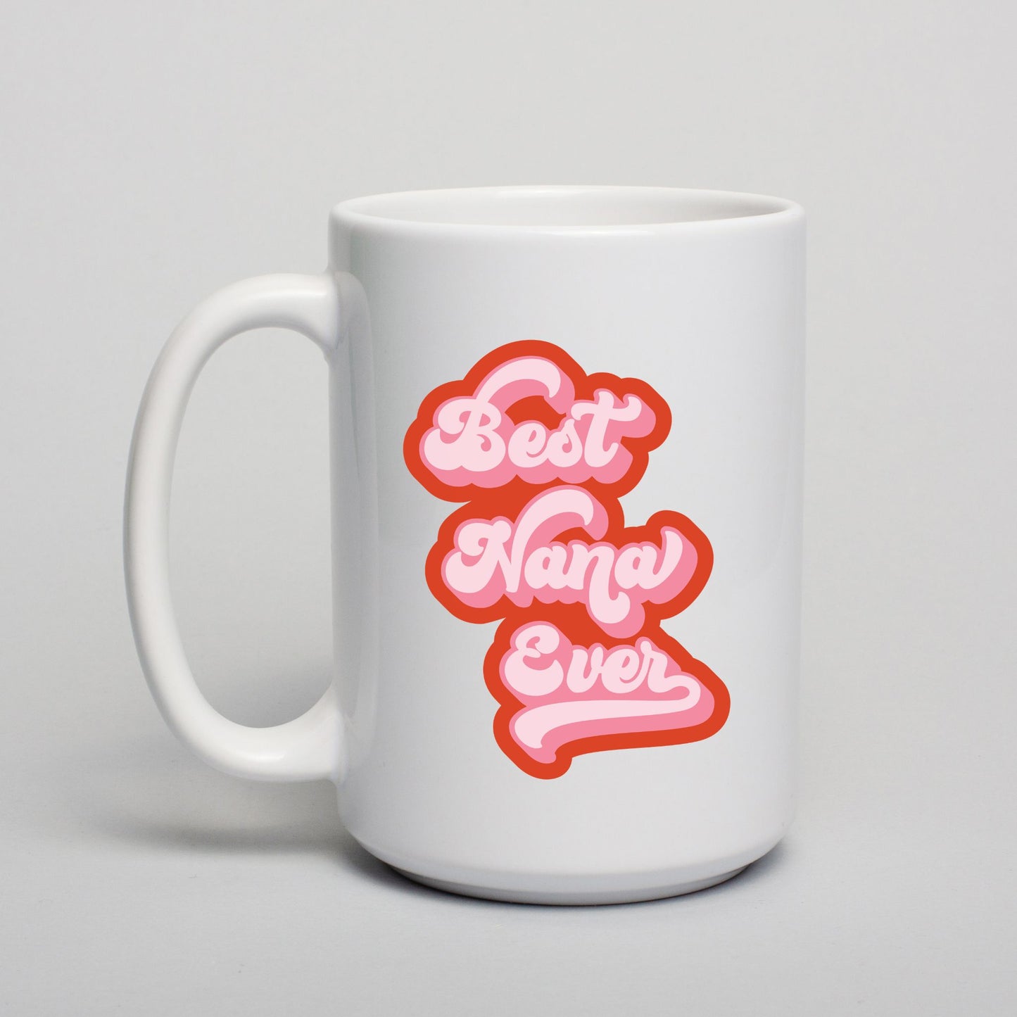 White mug with 'Best Nana Ever' text in pink and red on a light gray background