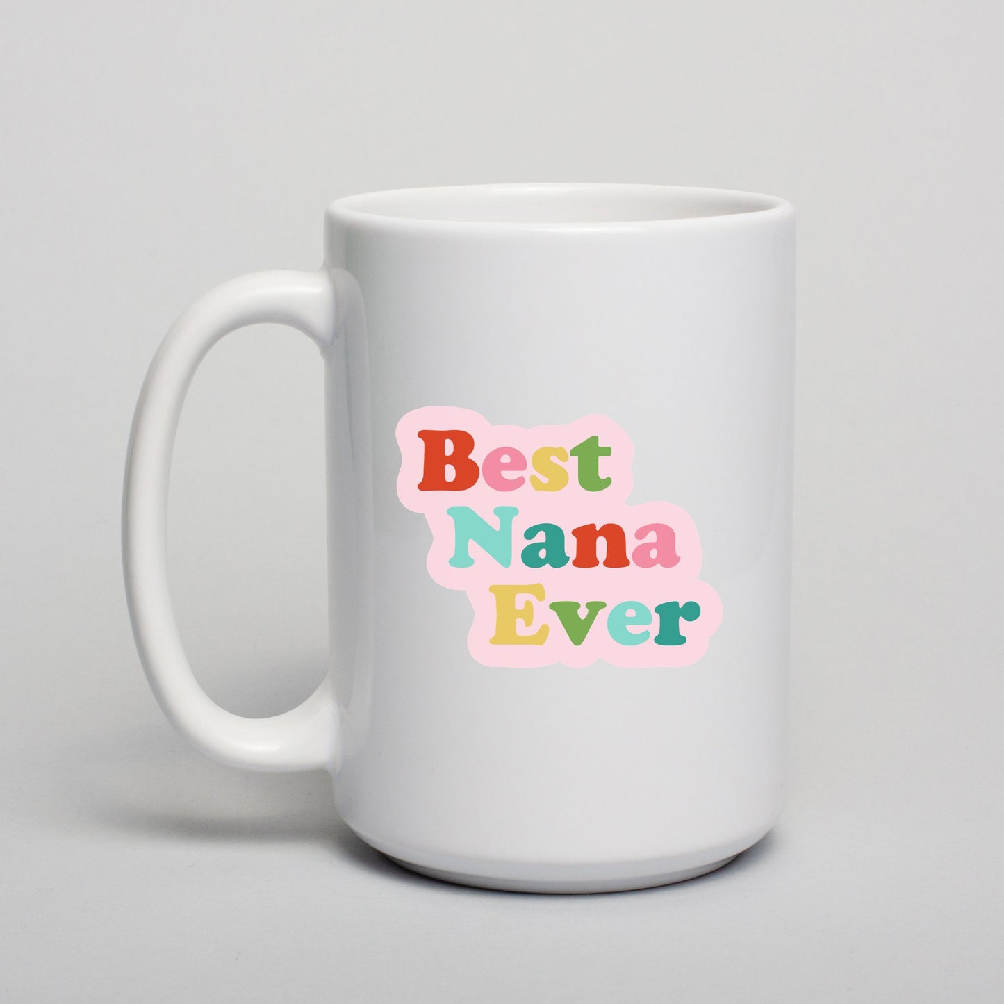 White mug with 'Best Nana Ever' text in colorful letters on a light gray background