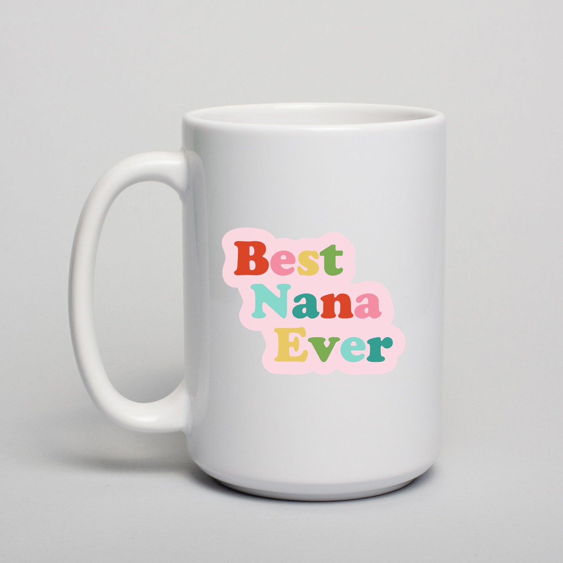 White mug with 'Best Nana Ever' text in colorful letters on a light gray background