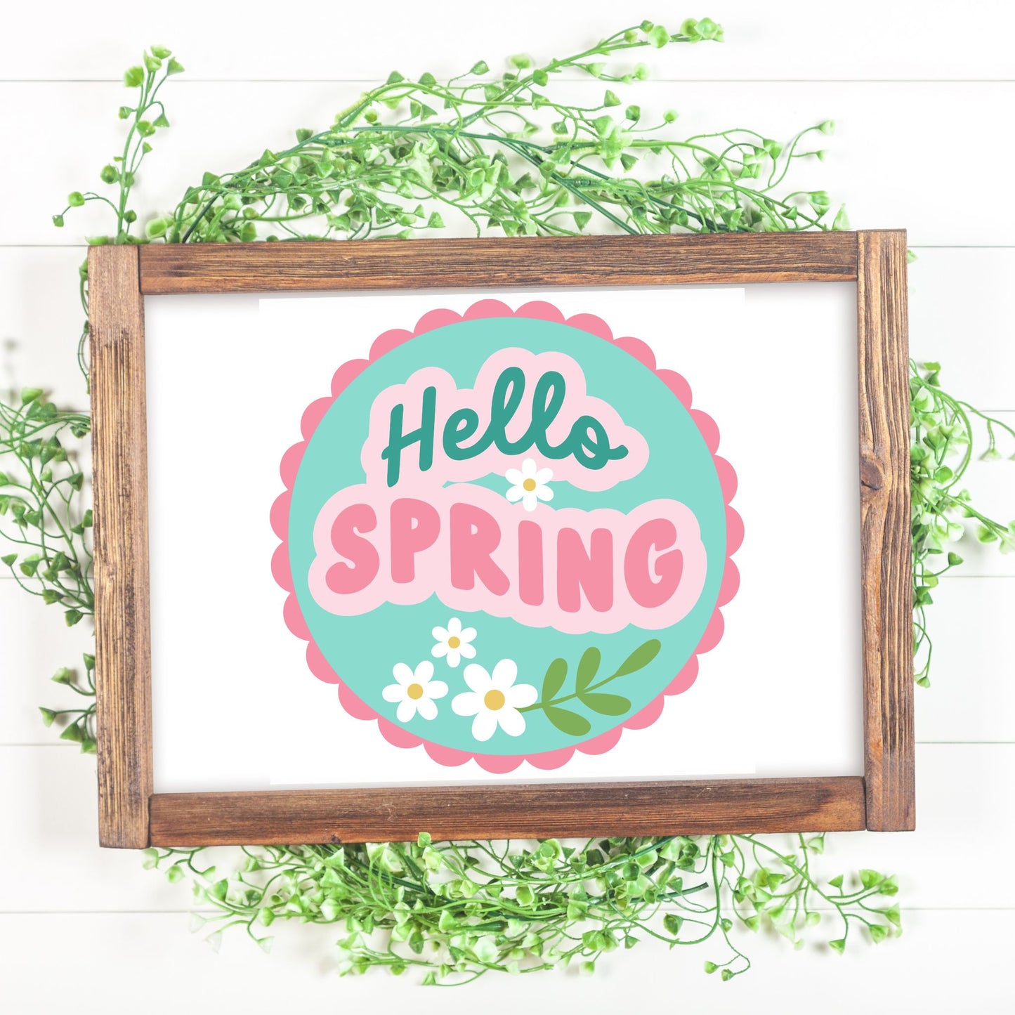 Framed 'Hello Spring' sign with decorative elements on a white background
